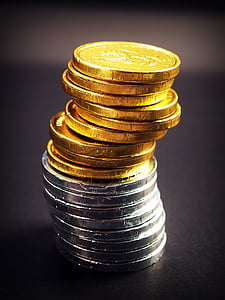 pile of round gold-colored and silver-colored coins thumbnail