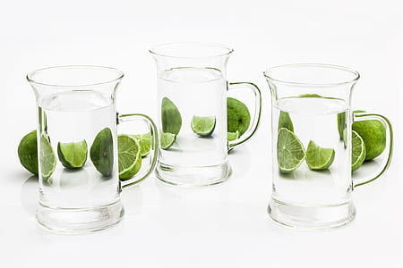 three clear glass mugs and slice lime fruit thumbnail