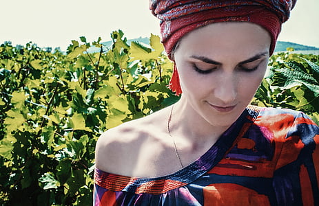 woman wearing blue and orange off-shoulder top thumbnail