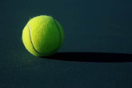 green tennis ball on ground thumbnail