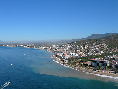 beach near the city at daytime thumbnail