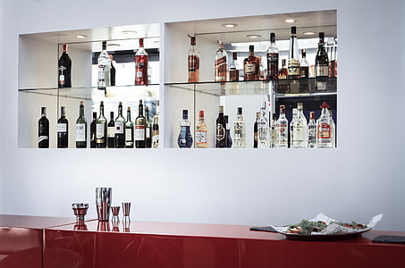 assorted glass bottle on shelf thumbnail