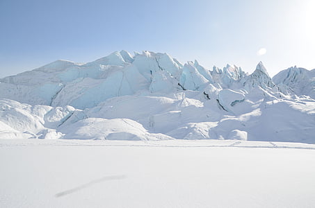 snow covered mountain under blue sky thumbnail