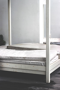 white mattresses on bed thumbnail