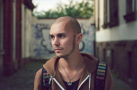 man wearing brown zip-up hoodie thumbnail