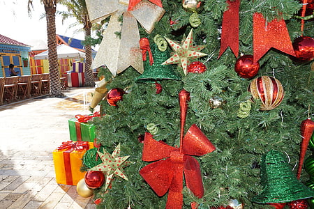 red ribbons hanged on Christmas tree thumbnail