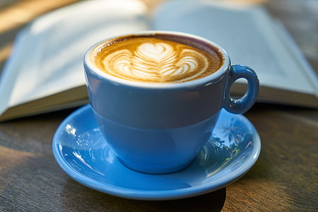 blue ceramic mug filled with coffee on saucer thumbnail
