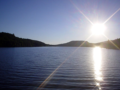 Sun over Christine Lake in Shark, New Hampshire thumbnail