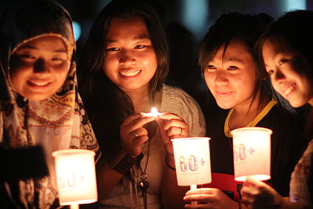 four women taking selfie while smiling thumbnail