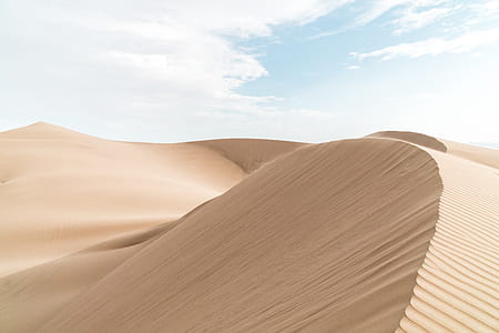 sand hills under white clouds thumbnail