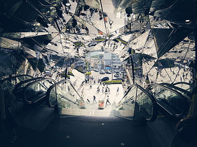 escalator inside building with glass ceiling thumbnail