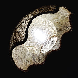 beige woven lamp turned on thumbnail