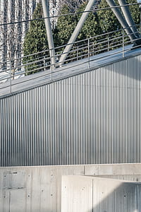 gray steel hand rails near green leafed tree during daytime thumbnail