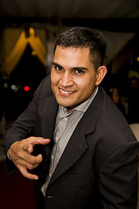 man in black notched lapel suit jacket thumbnail