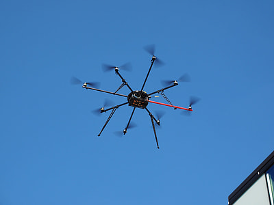 black and red drone at daytime thumbnail