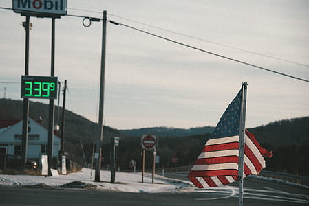 US flag near gasoline station thumbnail