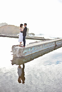 couple standing on dock thumbnail