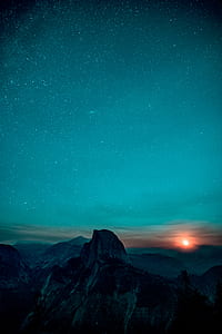 aerial photo of mountain at night thumbnail
