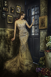 woman in brown floral dress near black door thumbnail