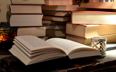 white opened book with books thumbnail
