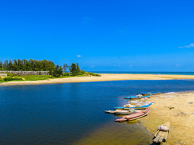 Beach with Canoe and boats with river, sea, and water thumbnail