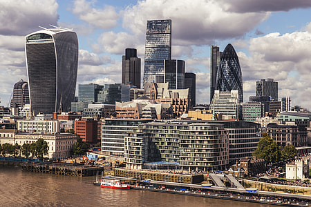 This shot was taken from the top of City Hall (The London Mayor’s Office) and shows the skyscrapers and buildings of the City of London (colloquially known as the Square Mile). This is the most historic part of the overall city of London and forms the heart of the financial district.Some of the famous buildings in this image include the Walkie Talkie, The Lloyd’s Building, The Gherkin (30 St Mary Axe), and The Cheese-grater (The Leadenhall Building) thumbnail