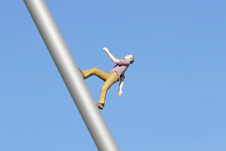 low angle photo of man figurine thumbnail