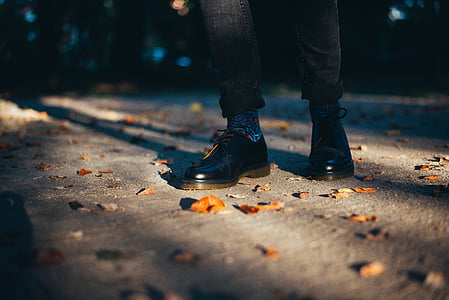 person in black leather shoes thumbnail