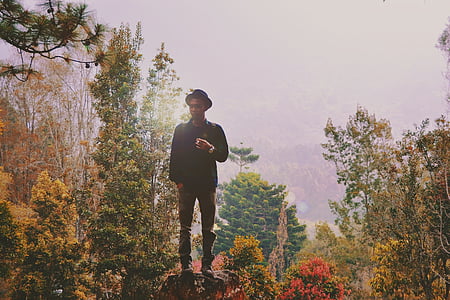 man standing on rock thumbnail