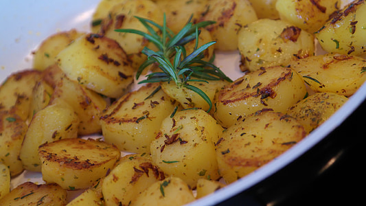 baked potatoes with parsley on ceramic casserole thumbnail