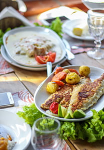 fried fish with vegetable salad on plate thumbnail