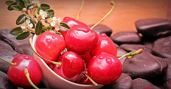 white ceramic bowl filled with cherries thumbnail
