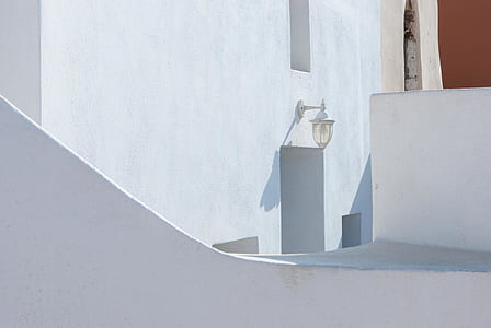 turned-off white wall sconce at daytime thumbnail