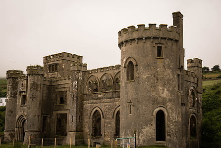 gray concrete castle near mountain thumbnail