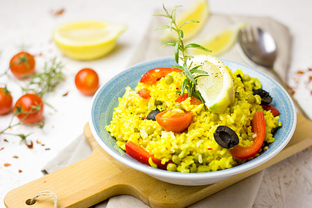 cooked rice with black olives and tomatoes in bowl thumbnail