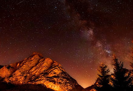 photography of mountain and sky during night time thumbnail