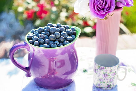 pitcher of blueberries near mug thumbnail
