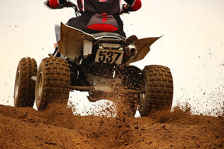 man riding black ATV thumbnail