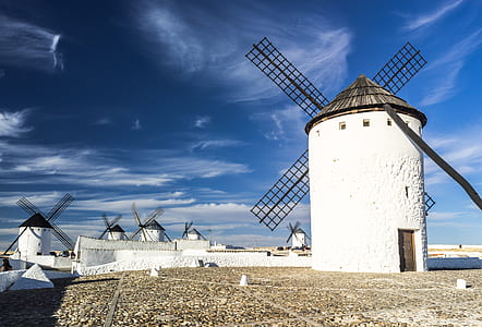 white windmills under blue sy thumbnail