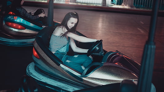 woman driving bumper car thumbnail