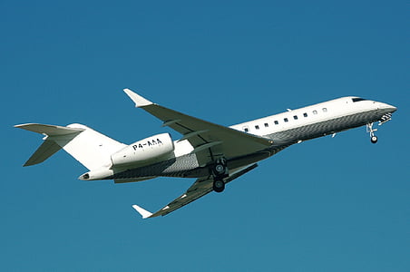 white and black airplane in flight thumbnail