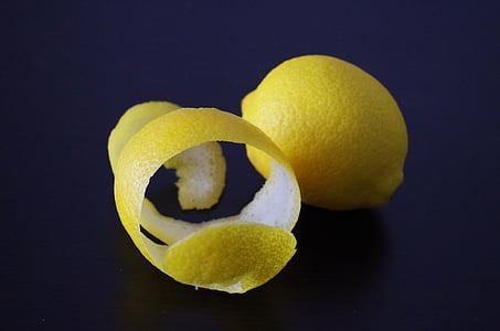 lemon fruit and lemon peel on blue surface thumbnail