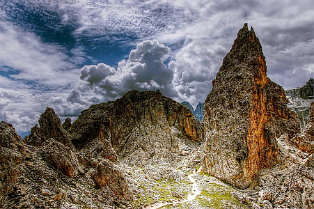 brown mountains under white clouds at daytime thumbnail