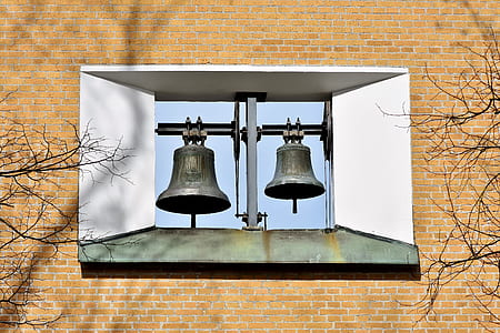minimalist photography of two bells thumbnail