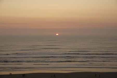 people standing beside shore during sunset thumbnail