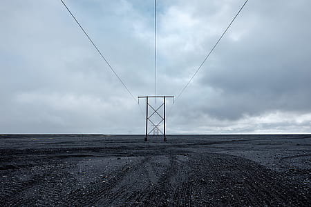 black post under gray clouds thumbnail