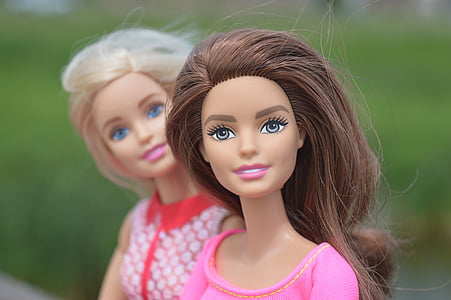 macro photography of two Barbie dolls thumbnail