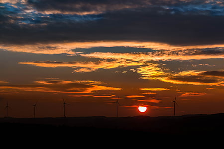 silhouette of windmills on sunset thumbnail