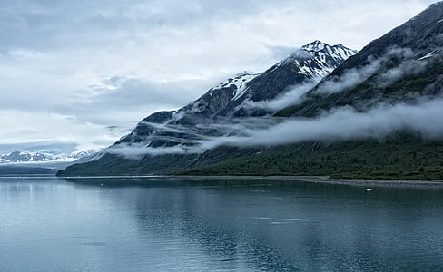 mountain in front of body of water thumbnail