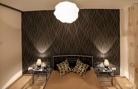 turned on table lamps on night stands thumbnail